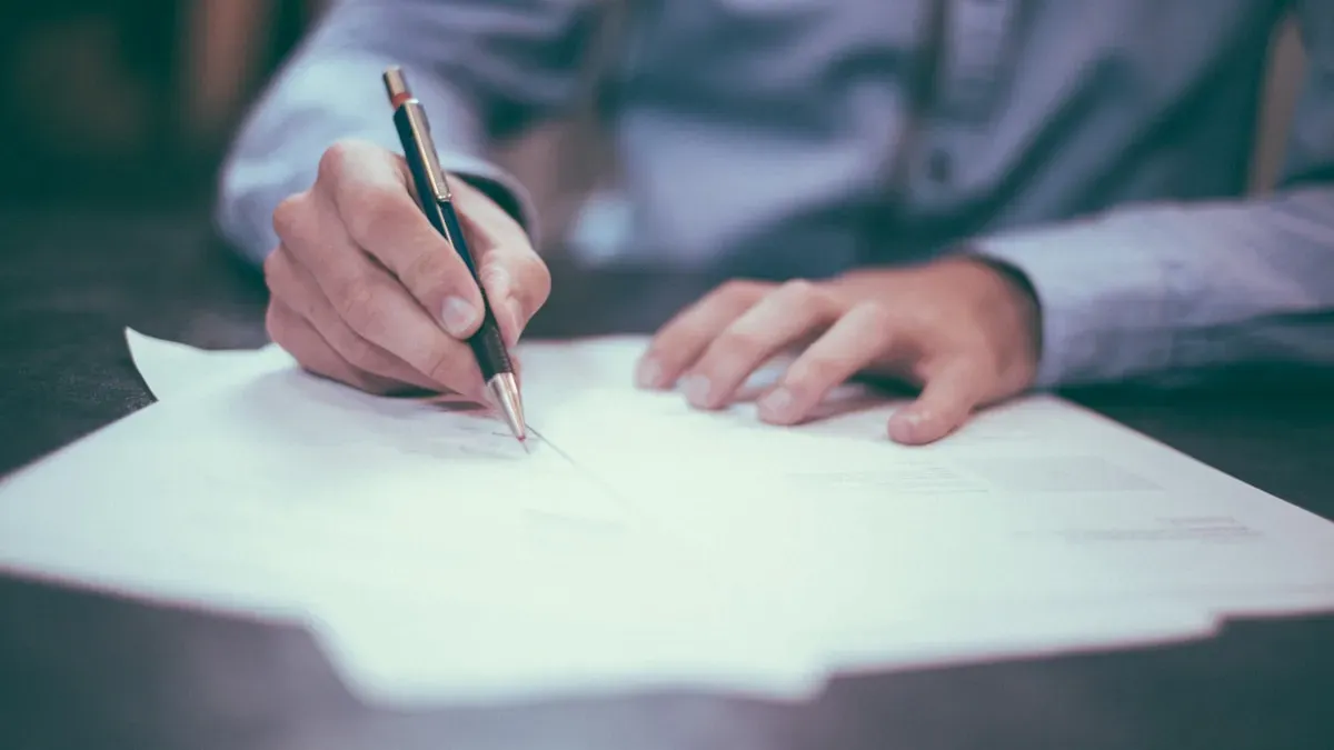 Person filling out a WSIB workplace injury claim form at a desk in Ontario